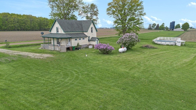 7917 E Harrison Rd, Breckenridge, MI 48615 - view of home's exterior with a yard and an outdoor pool