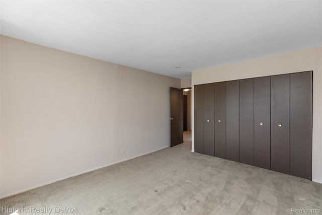 1300 E Lafayette St Unit 2502, Detroit, MI 48207 - unfurnished bedroom featuring light carpet and baseboards