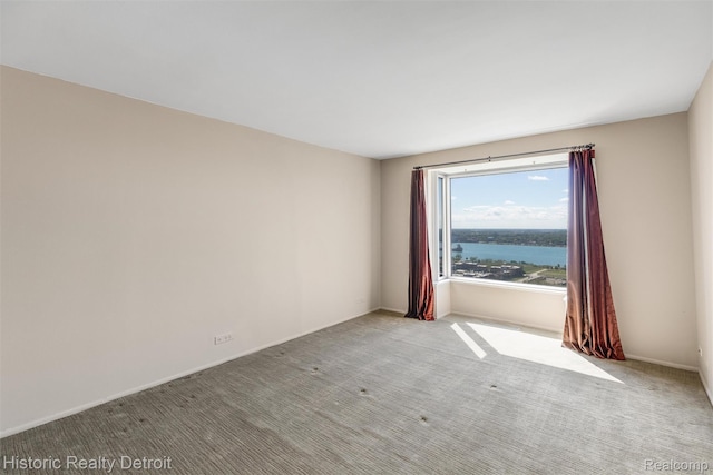 1300 E Lafayette St Unit 2502, Detroit, MI 48207 - carpeted spare room featuring baseboards
