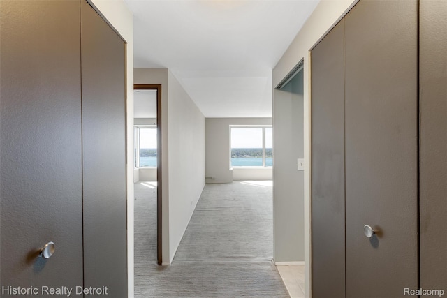 1300 E Lafayette St Unit 2502, Detroit, MI 48207 - corridor with light carpet and baseboards
