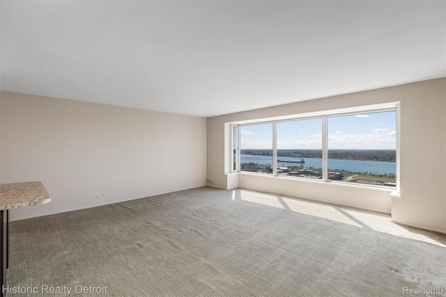 1300 E Lafayette St Unit 2502, Detroit, MI 48207 - carpeted empty room featuring a water view