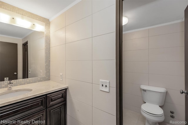 1300 E Lafayette St Unit 2502, Detroit, MI 48207 - bathroom featuring tile walls, ornamental molding, toilet, and vanity
