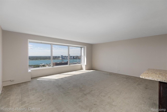 1300 E Lafayette St Unit 2502, Detroit, MI 48207 - carpeted empty room with a water view