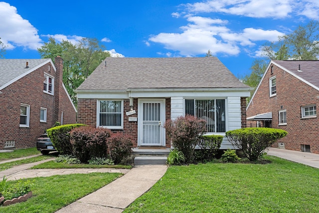 17693 Greenview Ave, Detroit, MI 48219 - bungalow-style home featuring a front yard and roof with shingles