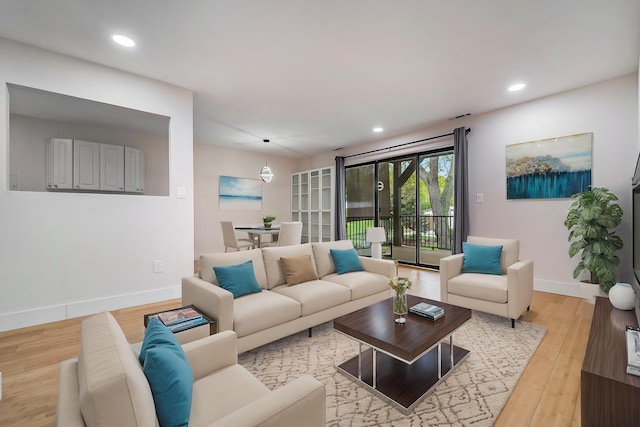 895 S Pontiac Trl Unit C206, Walled Lake, MI 48390 - living room with light wood-style flooring, baseboards, and recessed lighting