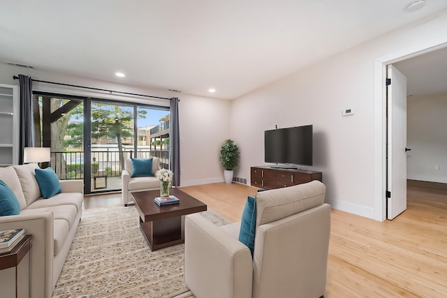 895 S Pontiac Trl Unit C206, Walled Lake, MI 48390 - living area with light wood-style flooring, baseboards, and recessed lighting