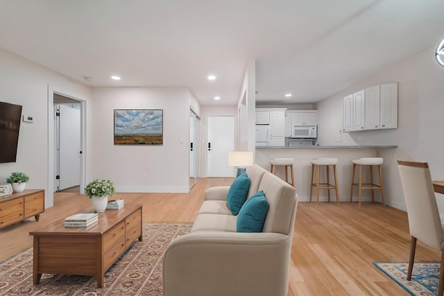 895 S Pontiac Trl Unit C206, Walled Lake, MI 48390 - living room featuring light wood finished floors, recessed lighting, and baseboards