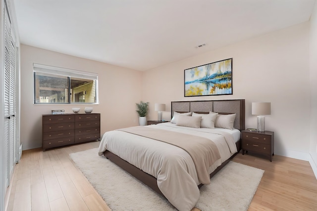 895 S Pontiac Trl Unit C206, Walled Lake, MI 48390 - bedroom with light wood-type flooring