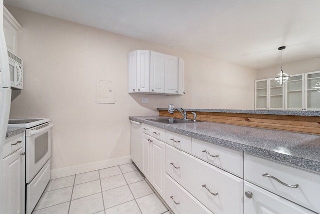 895 S Pontiac Trl Unit C206, Walled Lake, MI 48390 - kitchen with a sink, white appliances, white cabinetry, baseboards, and light tile patterned floors