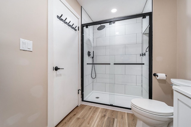 895 S Pontiac Trl Unit C206, Walled Lake, MI 48390 - full bath with toilet, tiled shower, wood finished floors, vanity, and recessed lighting