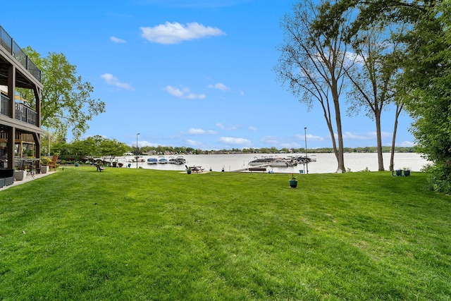 895 S Pontiac Trl Unit C206, Walled Lake, MI 48390 - view of green lawn with a water view and a dock