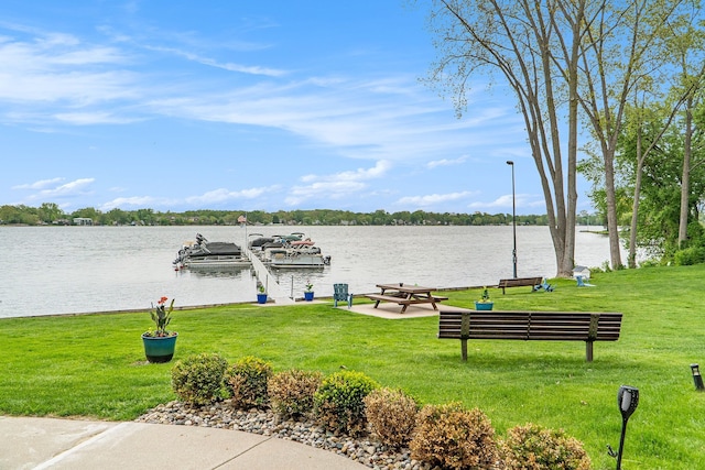 895 S Pontiac Trl Unit C206, Walled Lake, MI 48390 - dock area with a water view and a lawn