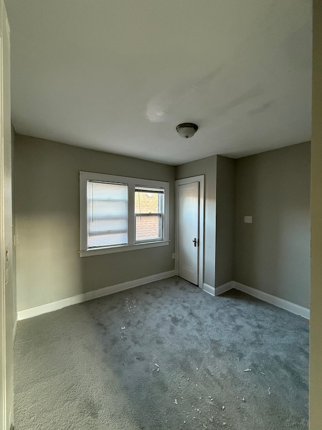 7130 Julian St, Detroit, MI 48204 - unfurnished bedroom featuring carpet floors, baseboards, and a closet