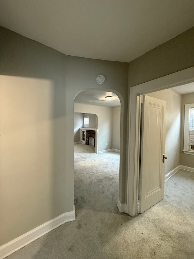 7130 Julian St, Detroit, MI 48204 - hall with arched walkways, carpet floors, and baseboards