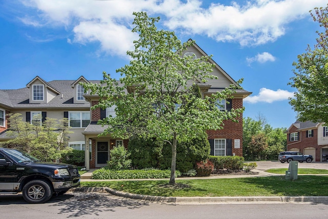 4049 Berkeley Ave Unit 25, Canton, MI 48188 - view of front of house with brick siding and a front lawn