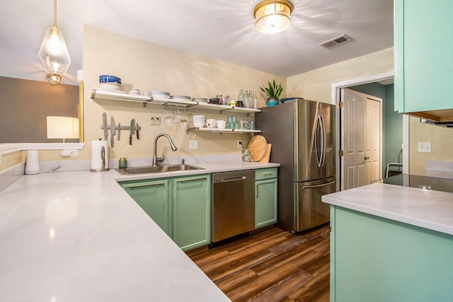 4049 Berkeley Ave Unit 25, Canton, MI 48188 - kitchen featuring green cabinetry, stainless steel appliances, a sink, open shelves, and light countertops