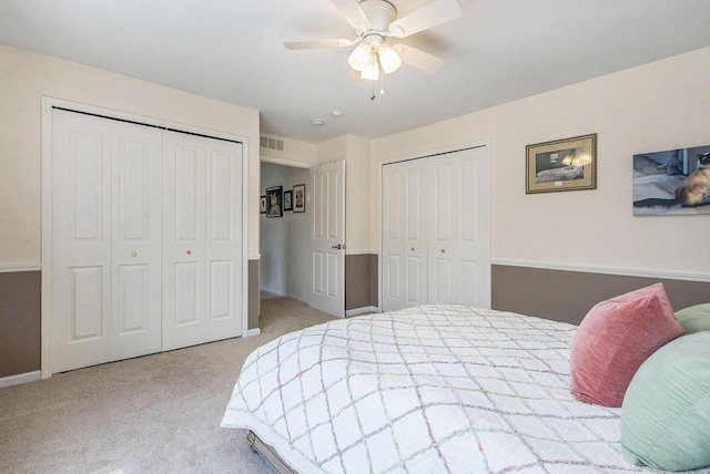 4049 Berkeley Ave Unit 25, Canton, MI 48188 - bedroom with two closets, carpet floors, baseboards, and ceiling fan