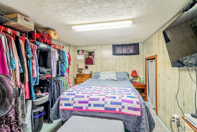 706 White Ave, Lincoln Park, MI 48146 - bedroom with a textured ceiling and wood walls