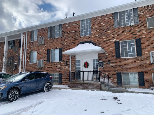 311 W Highland Rd Unit T13, Howell, MI 48843 - townhome / multi-family property featuring brick siding