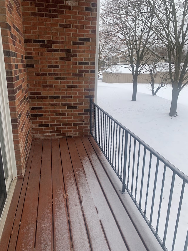 311 W Highland Rd Unit T13, Howell, MI 48843 - view of snow covered deck
