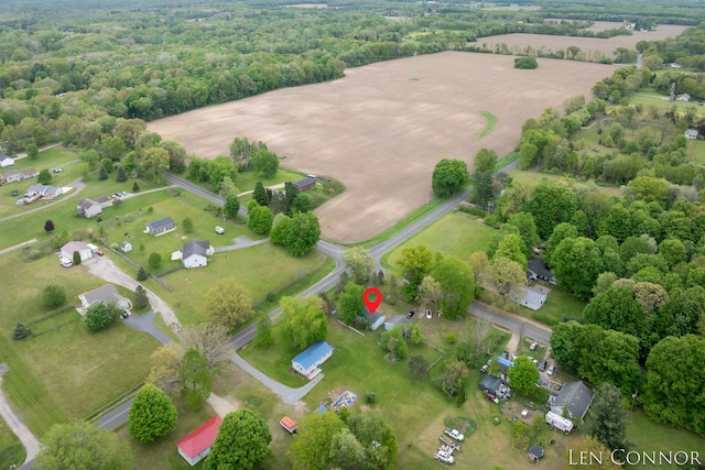 7975 Becker St NE, Cedar Springs, MI 49319 - aerial view of property and surrounding area with a heavily wooded area and rural landscape