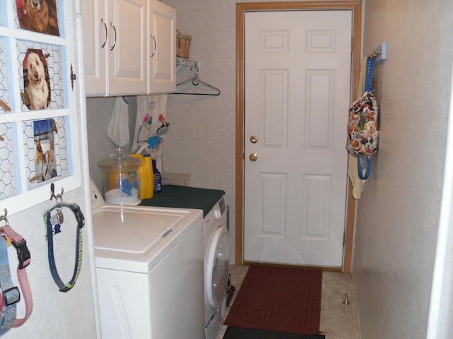 6515 Maple Rd, Ludington, MI 49431 - washroom with cabinet space and washing machine and dryer