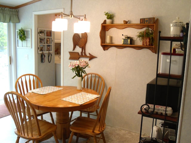 6515 Maple Rd, Ludington, MI 49431 - dining space featuring ornamental molding and a chandelier