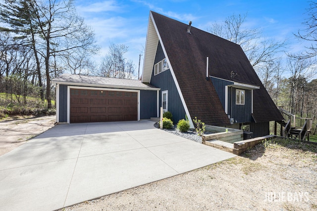 view of front facade featuring concrete driveway and roof with shingles