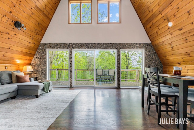living room with wood ceiling, high vaulted ceiling, hardwood / wood-style flooring, and wood walls
