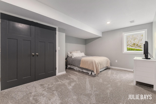 carpeted bedroom featuring baseboards and recessed lighting