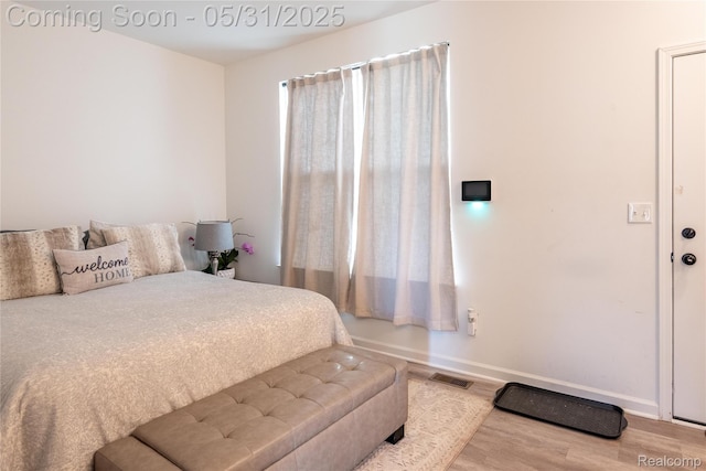 9480 White Tail Dr, Ypsilanti, MI 48197 - bedroom with wood finished floors and baseboards