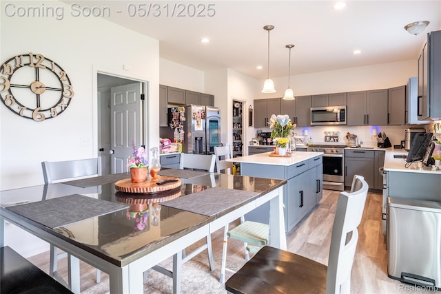 9480 White Tail Dr, Ypsilanti, MI 48197 - dining area with recessed lighting and light wood-style flooring