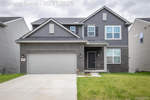 9480 White Tail Dr, Ypsilanti, MI 48197 - traditional home featuring brick siding, driveway, a front yard, and an attached garage