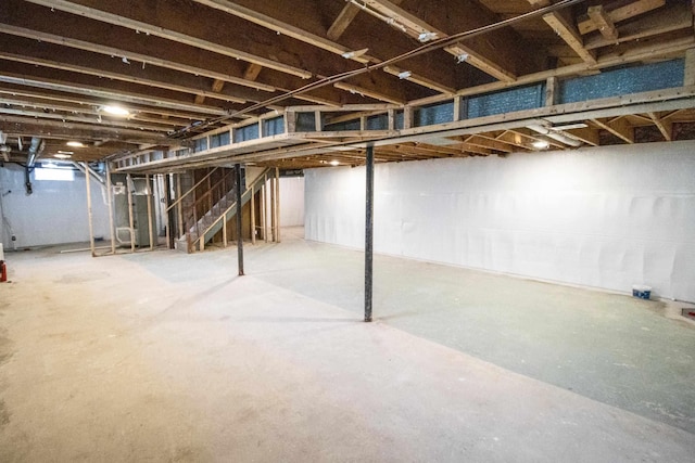 unfinished below grade area featuring stairs