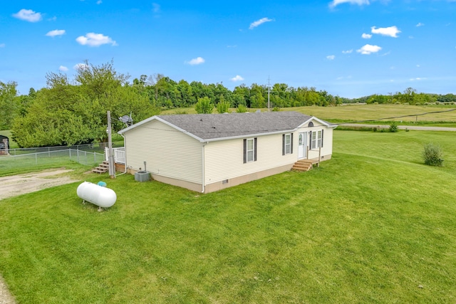 10060 Pioneer Rd, Hillsdale, MI 49242 - view of home's exterior featuring entry steps, cooling unit, crawl space, roof with shingles, and a rural view