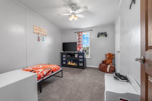 10060 Pioneer Rd, Hillsdale, MI 49242 - carpeted bedroom featuring ornamental molding, a glass covered fireplace, and ceiling fan