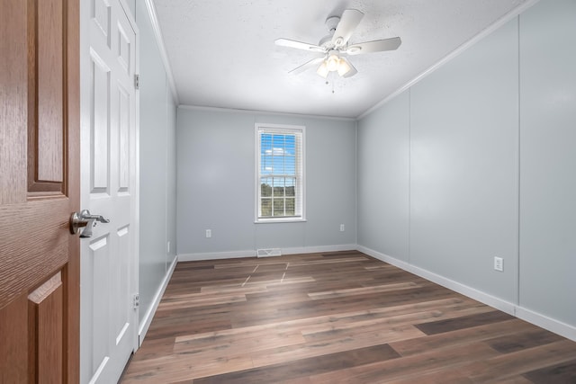 10060 Pioneer Rd, Hillsdale, MI 49242 - empty room featuring ornamental molding, wood finished floors, a ceiling fan, a textured ceiling, and baseboards