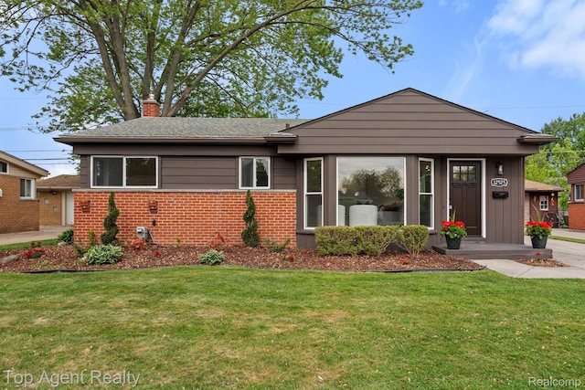 32525 Holden Dr, Warren, MI 48092 - view of front facade featuring a chimney, brick siding, and a front yard