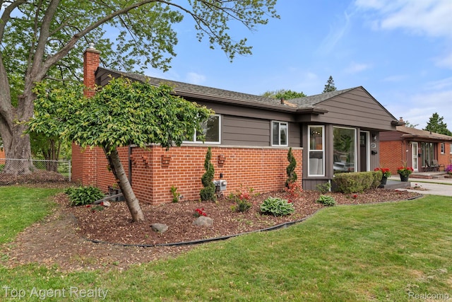 32525 Holden Dr, Warren, MI 48092 - view of front of home featuring brick siding and a chimney