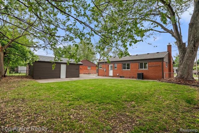 32525 Holden Dr, Warren, MI 48092 - rear view of house with cooling unit, brick siding, a chimney, a patio, and an outdoor structure