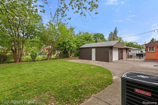 32525 Holden Dr, Warren, MI 48092 - view of yard with central AC unit, a garage, and an outbuilding