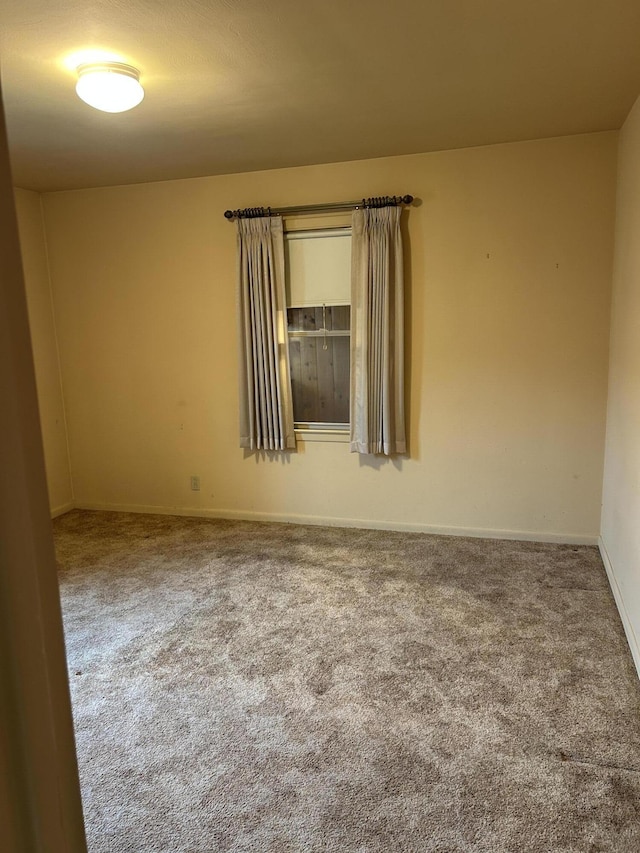 805 Capen St NE, Grand Rapids, MI 49505 - carpeted spare room with baseboards