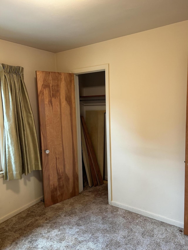 805 Capen St NE, Grand Rapids, MI 49505 - unfurnished bedroom featuring carpet and baseboards