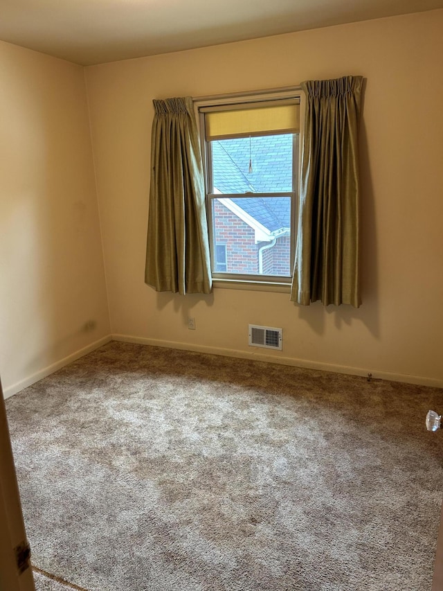 805 Capen St NE, Grand Rapids, MI 49505 - carpeted empty room with baseboards
