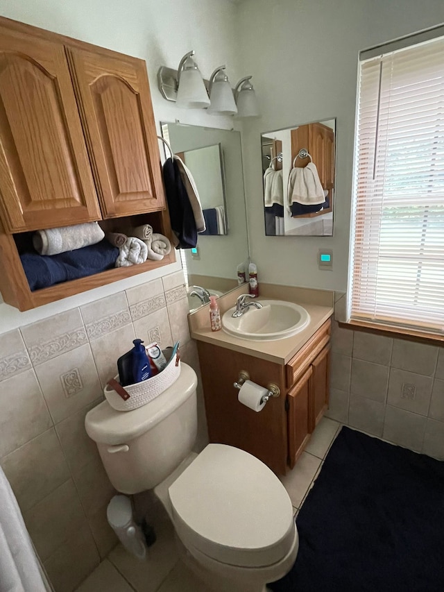15091 Sebastian Ct, Shelby Twp, MI 48315 - half bathroom with tile walls, tile patterned flooring, toilet, and vanity