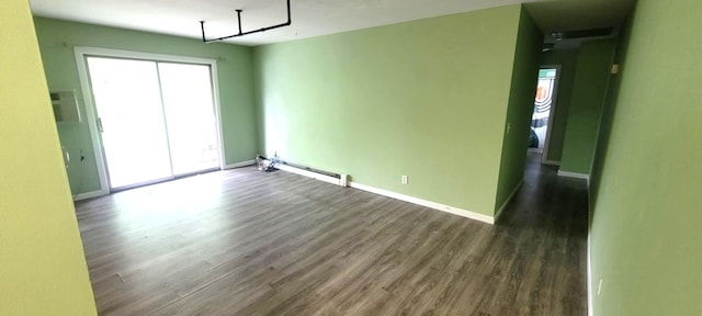 5374 36th Ave Unit 38, Hudsonville, MI 49426 - empty room with a baseboard heating unit, wood finished floors, and baseboards