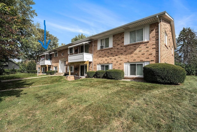 5374 36th Ave Unit 38, Hudsonville, MI 49426 - view of front facade with brick siding, a balcony, and a front lawn