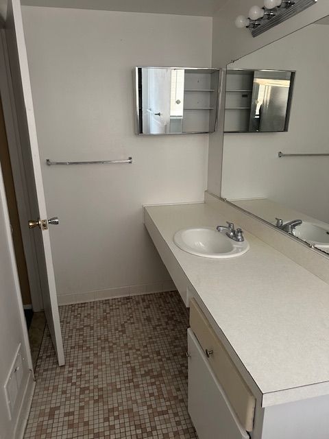 25332 Shiawassee Cir, Southfield, MI 48033 - bathroom featuring vanity and baseboards
