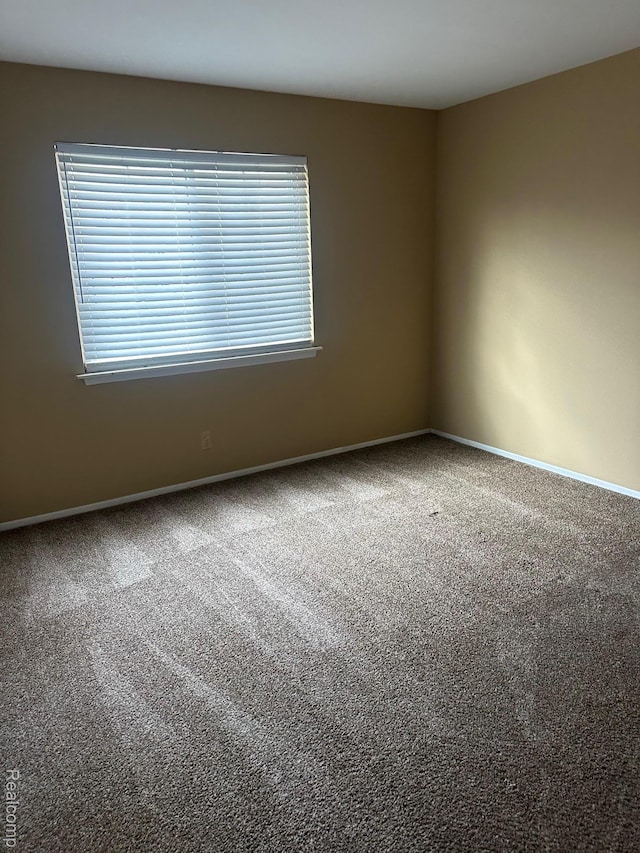 25332 Shiawassee Cir, Southfield, MI 48033 - carpeted empty room featuring baseboards