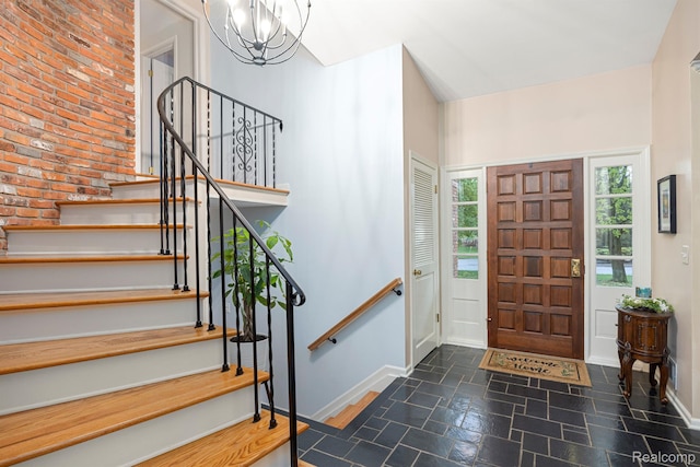 2960 Timberwyck Trail Dr, Troy, MI 48098 - foyer featuring baseboards, a chandelier, stairway, and dark stone finish flooring